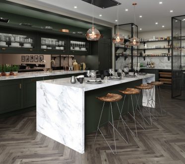 Undated Handout Photo of Max Out On Materials   Bespoke Portobello kitchen, with Carrara marble waterfall island with copper mirrored splash back and warm oak chevron floor. Deep green hand-painted cabinetry with satin antique lacquered Portobello  handles and antique brass tap, from £50,000, Mark Wilkinson Furniture.  See PA Feature INTERIORS Kitchen. Picture credit should read: Mark Wilkinson Furniture/PA Photo/Handout. WARNING: This picture must only be used to accompany PA Feature INTERIORS Kitchen. WARNING: This picture must only be used with the full product information as stated above.